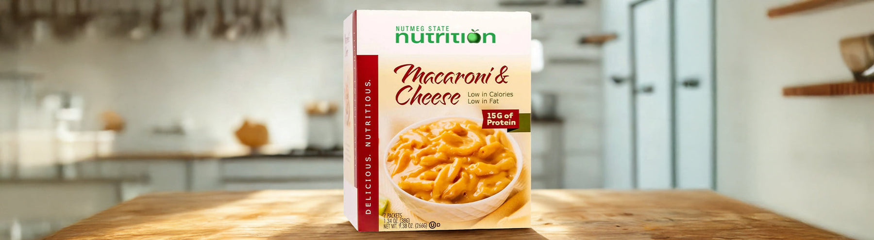 Box of Nutmeg State Nutrition Macaroni & Cheese, labeled low in calories, low in fat, with 15 grams of protein per serving.