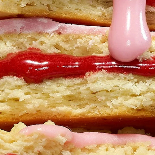 Close-up of Legendary Pop-Tarts stacked on top of one another with icing and filling dripping down.